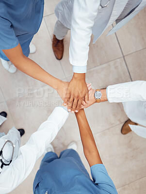 Buy stock photo Motivation, teamwork or hands of doctors in hospital for healthcare goals, unity or solidarity together. Clinic, top view or medical nurses with group support, trust or wellness mission in clinic 