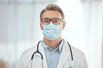 Man, portrait and doctor with face mask in hospital for medical services, surgery and wellness consulting. Male surgeon, mature therapist and healthcare manager working with safety ppe in clinic 