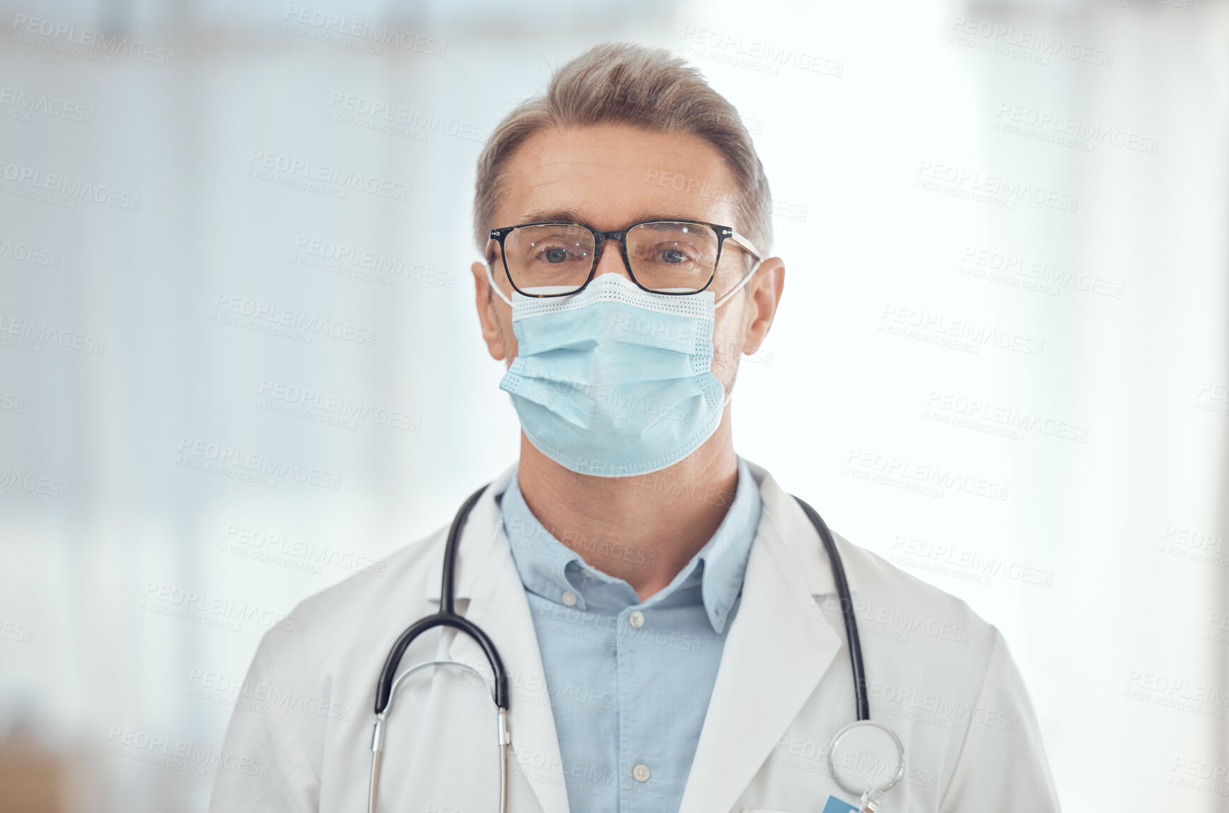 Buy stock photo Man, portrait and doctor with face mask in hospital for medical services, surgery and wellness consulting. Male surgeon, mature therapist and healthcare manager working with safety ppe in clinic 