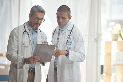 Teamwork, senior or doctors with checklist in hospital meeting or discussion for collaboration together. Leader, help or surgeons talking or speaking of healthcare schedule, report or data analysis 