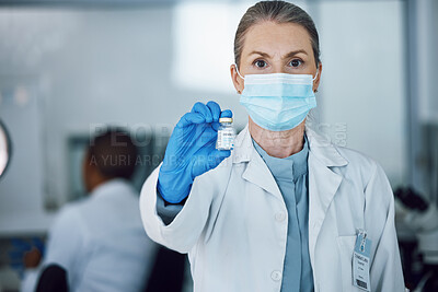 Buy stock photo Portrait of woman doctor with face mask and vaccine bottle in hand at hospital laboratory for covid research. Healthcare, medicine and medical professional with sample for corona vaccination in lab.