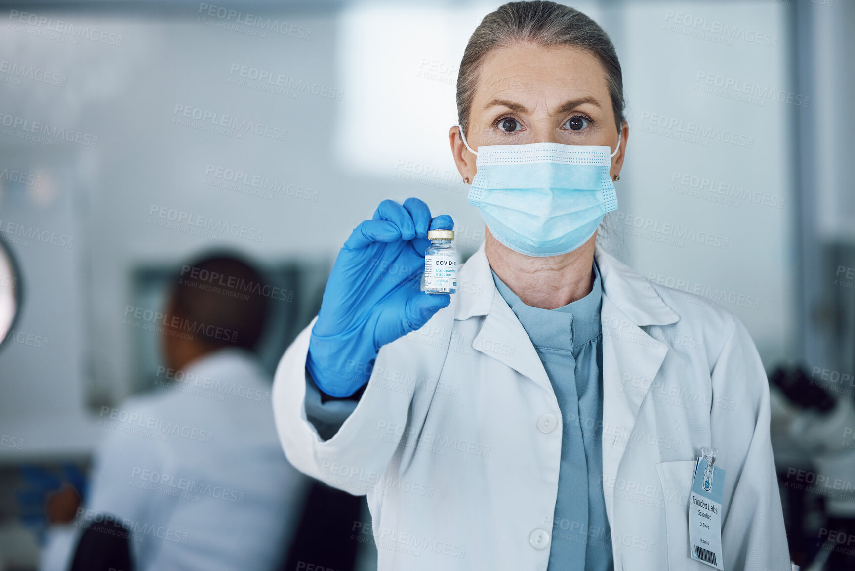 Buy stock photo Portrait of woman doctor with face mask and vaccine bottle in hand at hospital laboratory for covid research. Healthcare, medicine and medical professional with sample for corona vaccination in lab.