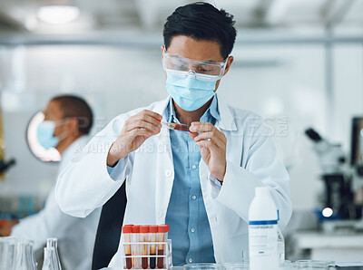 Buy stock photo Exam, blood sample and scientist doing research with face mask in a laboratory for medical analysis in a lab. Science, medicine and professional Asian man working on test of DNA in a vial tube