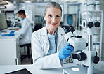 Microscope, scientist and portrait of senior woman in laboratory to review virus research, medical test and biotechnology. Science, microbiology and happy female professor planning expert assessment