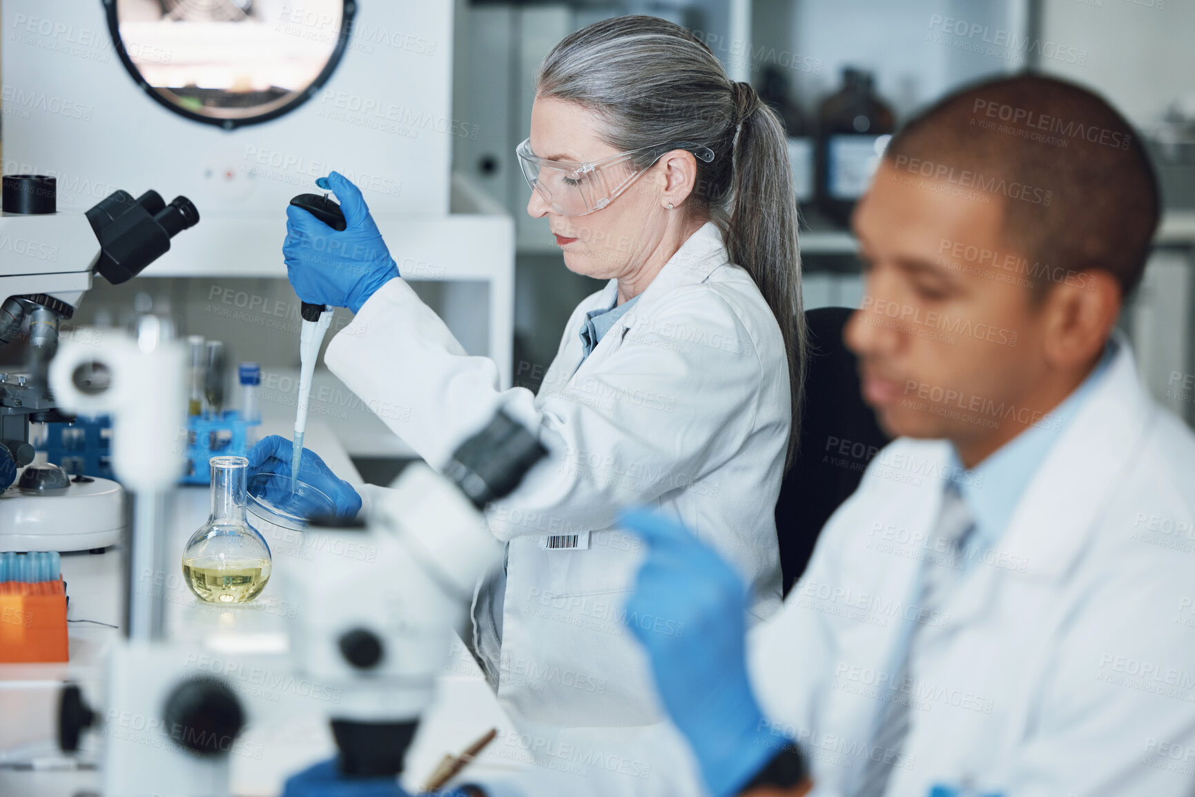 Buy stock photo Laboratory research, pipette and scientist team working on biotechnology, chemistry investigation or pharmaceutical. Lab sample, vaccine analysis and people work on scientist experiment, test or exam