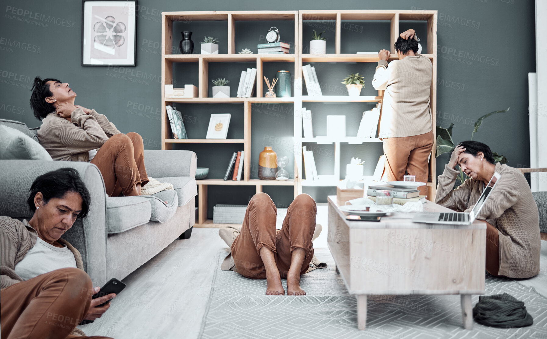 Buy stock photo Mental health, depression or anxiety with a busy woman in the living room of her home during a financial crisis. Stress, headache and burnout with a senior female person multitasking in her house