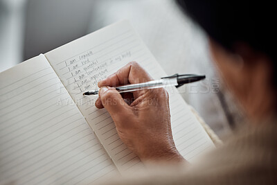 Buy stock photo Hand, book and writing for affirmation with an old woman in her home for support or motivation. Journal, diary or notebook with a senior person holding a pen for self confidence during retirement