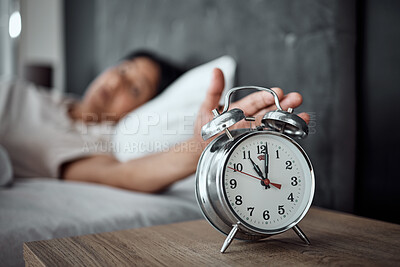 Buy stock photo Alarm, sleeping and a hand with a clock for awake, oversleep or tired in the bedroom of a home. House, ring and a closeup of a person or woman in bed for snooze, rest or waking up lazy in a house