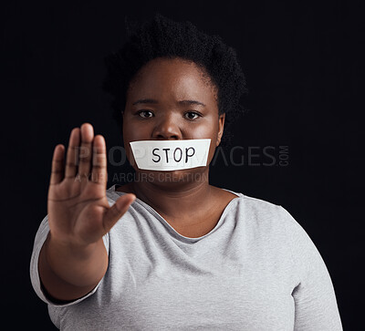 Portrait, stop and palm with a black woman in studio on a black background for gender equality or domestic violence. Hand, silence or abuse and a scared female victim with her mouth covered in fear