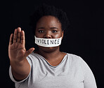 Portrait, hand and a black woman in protest of domestic violence on a dark background. Freedom, equality or empowerment with the palm of a serious young person in studio for gender discrimination 