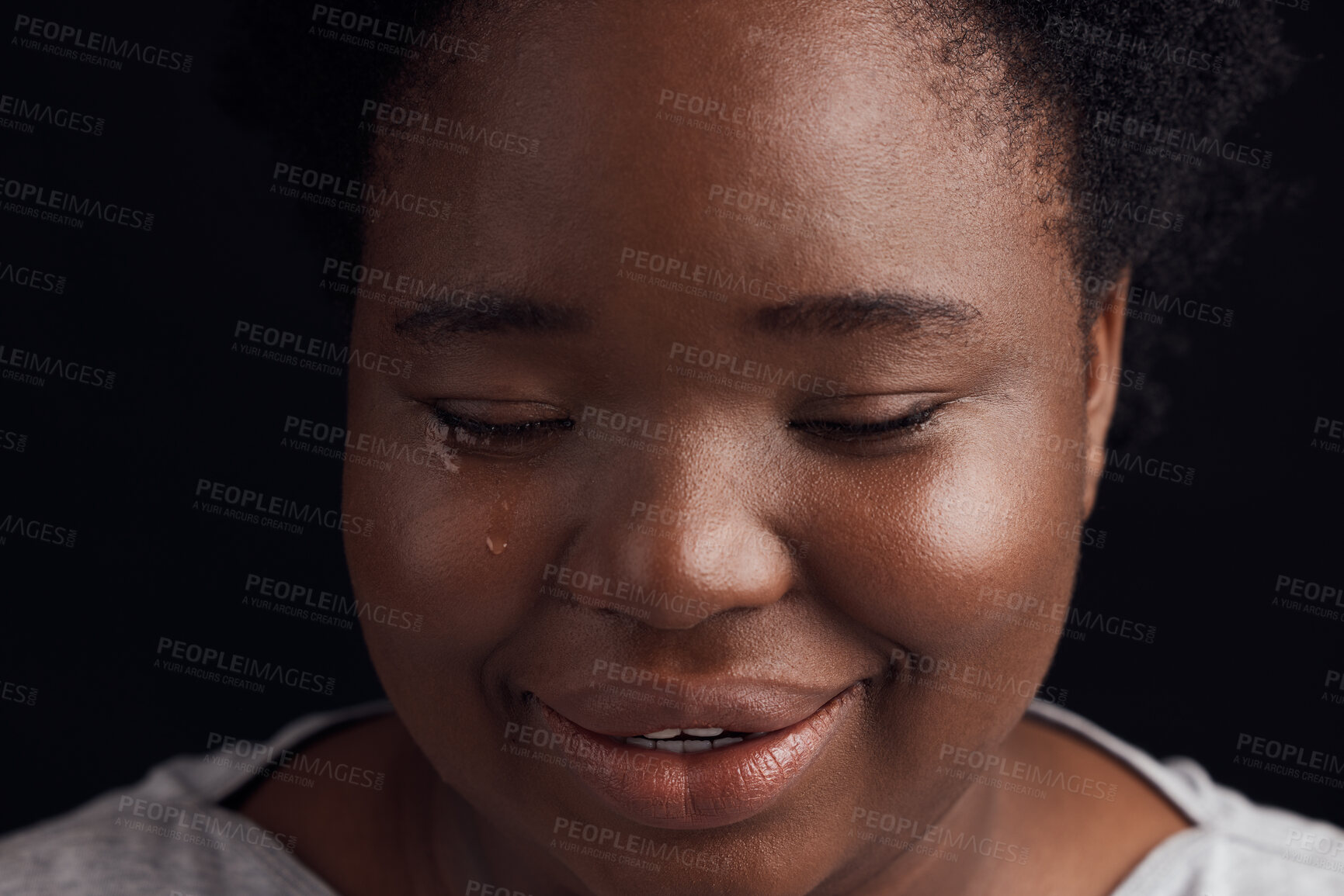 Buy stock photo Crying, sad and a black woman on a studio background with depression, fear or mental health. Studio, face and an African girl or person with tears, frustrated or fail from a mistake on a backdrop