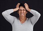 Anger, anxiety and senior woman screaming, depression and mental health issue on a dark studio background. Person, emotion or model shouting, frustrated and angry with bipolar, moody and lose control