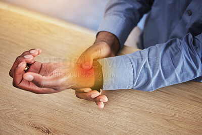 Business person, wrist pain and red injury from osteoporosis, orthopedic joint and arthritis in office. Closeup, hands and worker with carpal tunnel, health risk and muscle fatigue of fibromyalgia