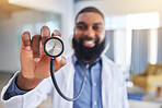 Doctor, man and hands with stethoscope for heartbeat, healthcare services and cardiology. Closeup of happy medical worker with listening tools to check heart, lungs and breathing test in hospital 