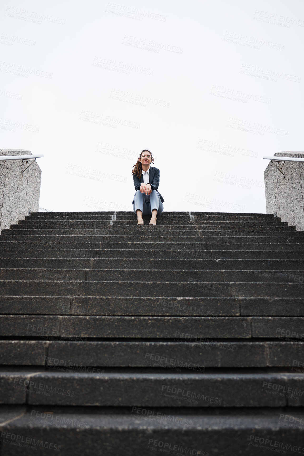 Buy stock photo Business woman, sitting and stairs in portrait, low angle and mockup space in city, metro and relax on break. Young entrepreneur, urban cbd and freedom on steps with corporate fashion, pride or smile