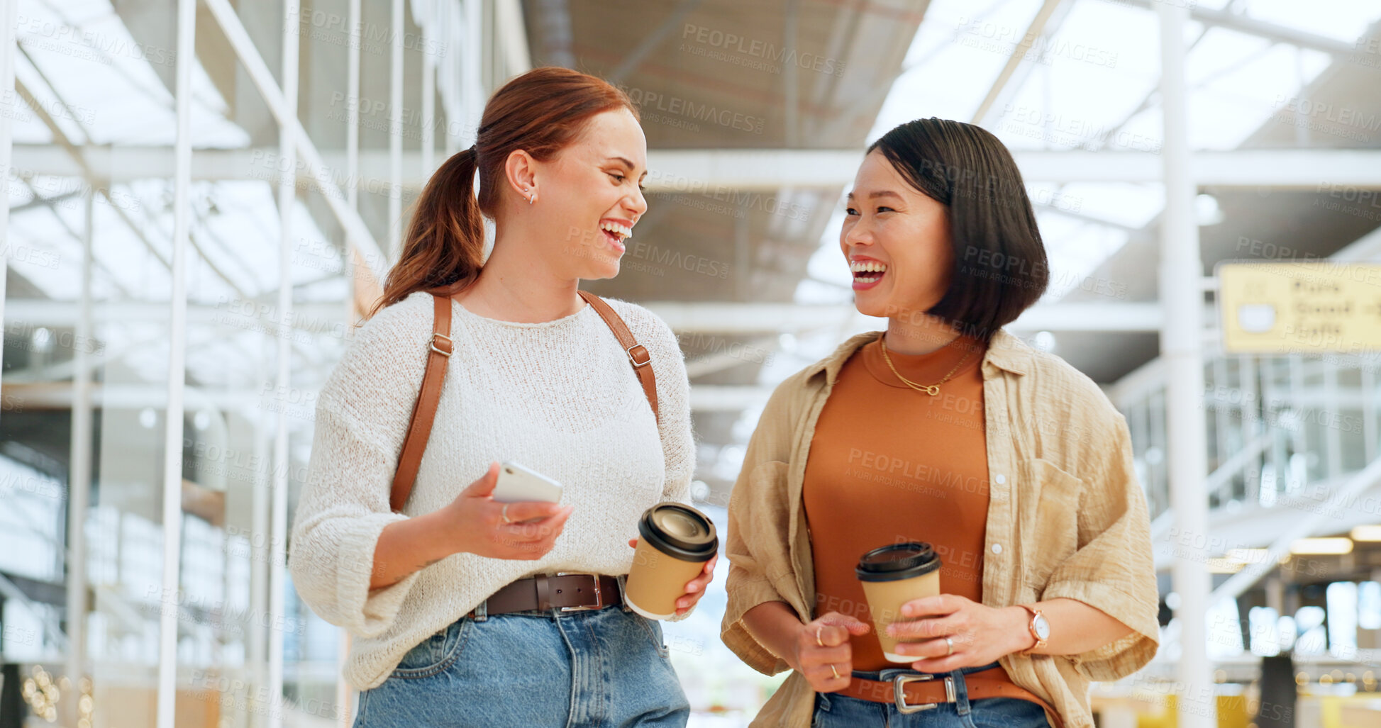 Buy stock photo Creative business woman, friends and walking with coffee in funny discussion laughing together at the office. Happy employee women enjoying walk, social conversation and drink in startup at workplace