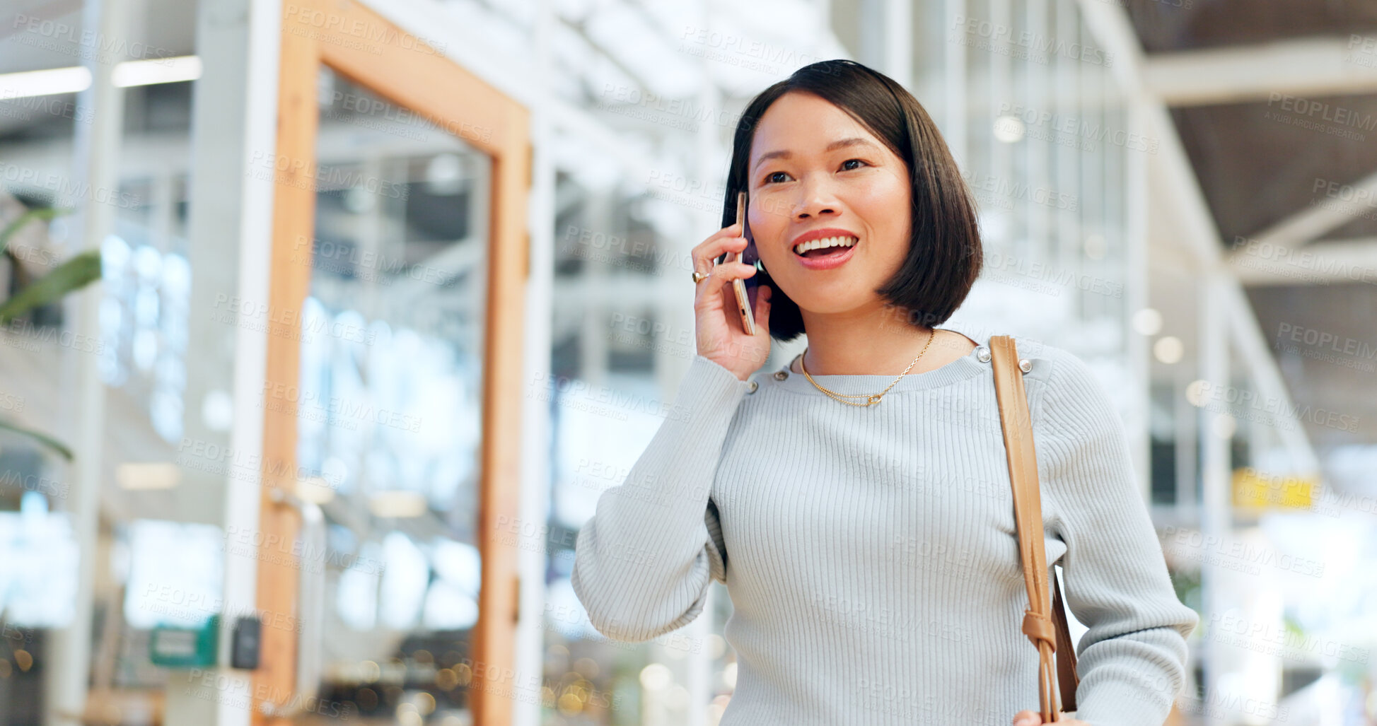 Buy stock photo Asian business woman on a phone call walking in office building and networking online, strategy negotiation or global communication. Corporate Seoul employee in lobby talking on a smartphone chat app