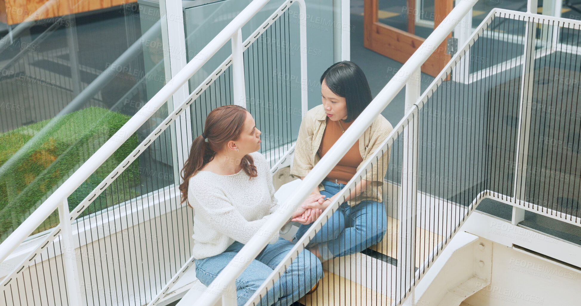 Buy stock photo Friends, women sitting on stairs at apartment building and talking, sharing advice and support in life crisis. Trust, help and sad woman with friend on steps having a talk about problem outside home.