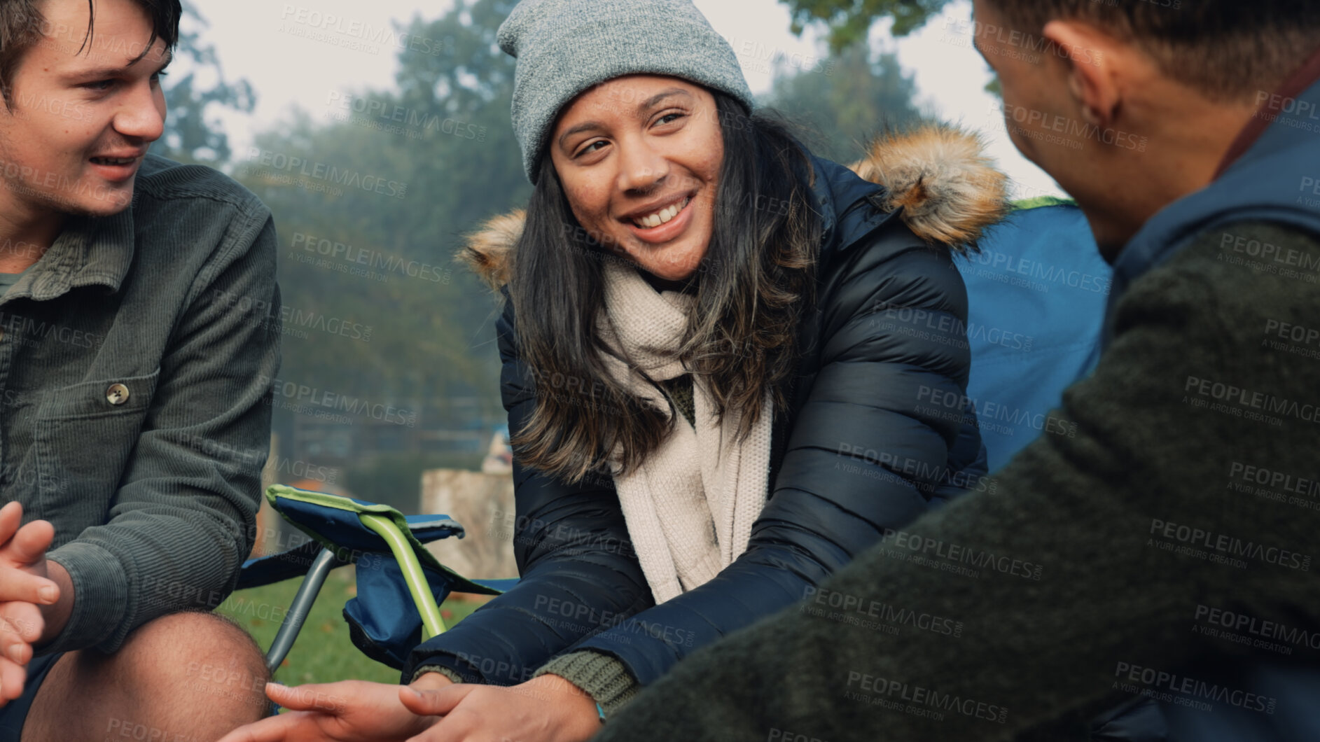 Buy stock photo Friends camping, talking and relax in nature, forest or woods together, men and woman smile on happy winter holiday. Camp, adventure and people bonding on outdoor vacation with morning conversation.