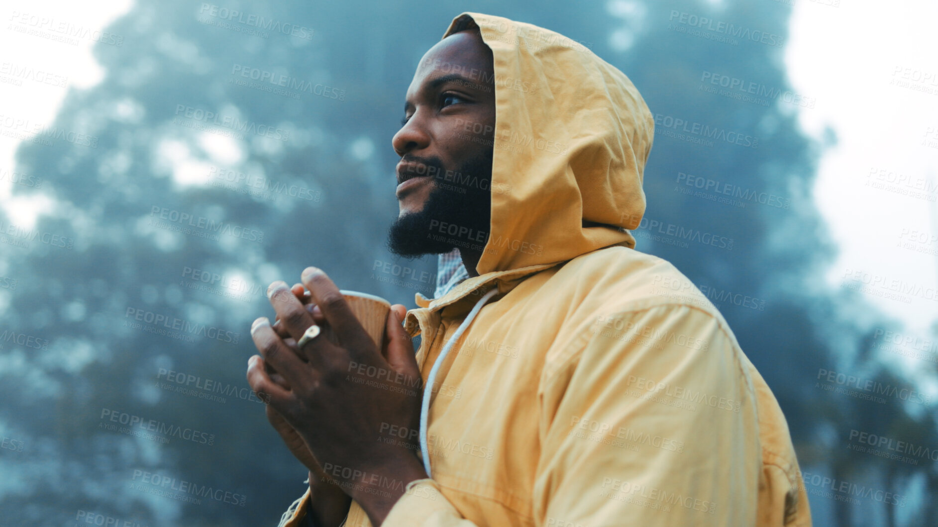 Buy stock photo Coffee, morning and black man hiking in the forest for camping, holiday or vacation in winter weather. Thinking, raincoat or face of a young male hiker in the woods or nature to explore for adventure