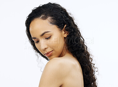 Buy stock photo Face, beauty and skin with a model black woman looking at her shoulder in studio on a white background. Portrait, skincare and sensual with an attractive young female admiring her smooth or soft body