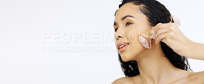 Buy stock photo Black woman, face and beauty with facial roller, skincare routine and natural cosmetics isolated on white background. Dermatology mockup, skin and cosmetic tools, female model hand and rose quartz