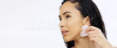 Buy stock photo Black woman, face and beauty with gua sha for skincare, facial and exfoliate isolated on white background. Dermatology, skin glow and cosmetic tools, female model satisfied with hand and mockup