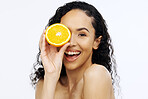 Orange fruit, skincare and face of woman in studio, clean wellness and white background. Happy model, beauty portrait and citrus fruits for natural detox diet, healthy food and aesthetic dermatology