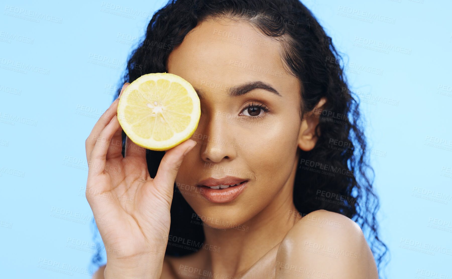 Buy stock photo Lemon, face skincare and beauty of woman in studio, vegan wellness or blue background. Model, portrait and citrus fruits for facial cosmetics, vitamin c aesthetic or healthy natural detox dermatology