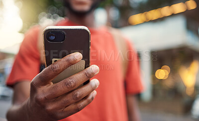 Buy stock photo Closeup, city and hand with a smartphone, typing and connection to check emails, chatting and message. Man, cellphone and mobile app with network, outdoor and social media with website information
