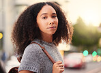 Young, serious and portrait of a woman in the city waiting for a cab, lift or public transport. Beautiful, confident and headshot of a female person from Mexico walking in an urban town street.