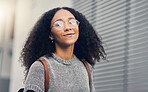 Woman, portrait and city travel of student with glasses on a street with freedom. Urban, university holiday and happy face of young African person walking with backpack on adventure vacation outdoor