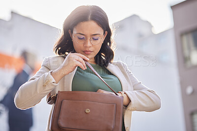 Buy stock photo Business woman, handbag searching and employee in city looking to find in purse. Urban, young and professional with missing and lost item in bag for career and commute to work with worker on street