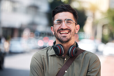 Buy stock photo Travel, city and portrait of a man outdoor on a road with a smile, glasses and headphones. Happy student or business person on urban street with freedom and pride for creative internship in Miami