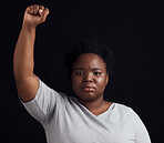 Portrait, serious and a black woman on a black background for a protest, justice or social freedom. Riot, fight and an African girl ready for government change, conflict or a revolution on a backdrop