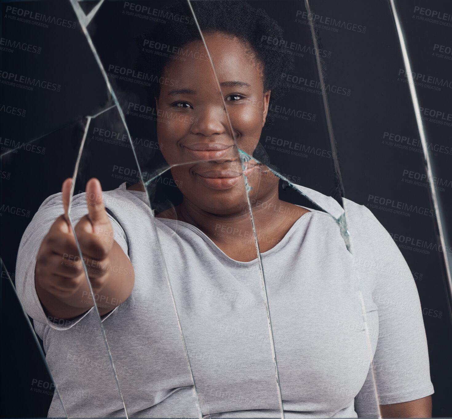 Buy stock photo Healing, success and woman portrait with thumbs up in broken mirror after depression and stress in studio. Face, smile and African female abuse survivor emoji hand for feedback on bipolar treatment