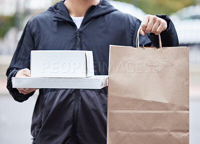 Buy stock photo Courier man, paper bag and hands for pizza, service and delivery in urban city for supply chain job. Logistics worker, package and street for customer satisfaction, product or e commerce in metro cbd