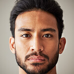 Face, portrait and serious asian man in studio with focus, wellness and awareness. Headshot of a young male model isolated on a grey background with concentration, vision and  stern expression