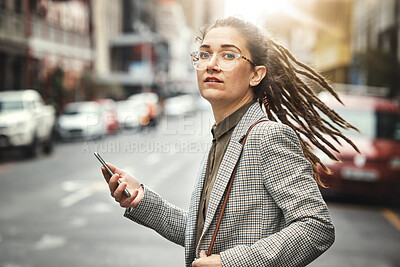 Buy stock photo Phone, portrait and business woman in city for social media, email and typing at sunset commute. Mobile, consultant and serious face of professional from Switzerland with glasses in street for travel