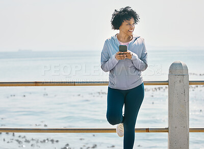 Buy stock photo Happy, phone and fitness with black woman at beach for running, workout and mockup. Network, communication and contact with female runner training in nature for technology, sports and mobile