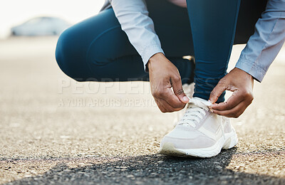 Buy stock photo Sports, closeup and woman tie shoes outdoor in the road for running workout in the city. Fitness, health and zoom of female athlete tying her laces for cardio exercise for race or marathon training.