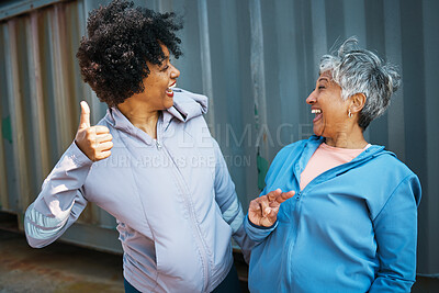 Buy stock photo Happy, sports and senior women friends bonding and posing after a workout or exercise together. Happiness, smile and elderly female athletes with hand signs in sportswear after training by a wall.