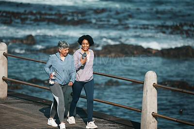 Buy stock photo Fitness, walking and woman and senior mother by ocean for healthy body, wellness and cardio on promenade. Sports, happy and female people on boardwalk for exercise, marathon training and workout