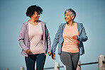 Fitness, exercise and senior women by ocean for healthy lifestyle, wellness and cardio on promenade. Sports, friends and female people in conversation on boardwalk for walking, training and workout