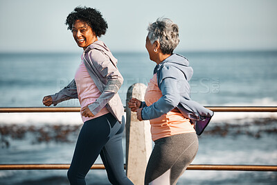 Buy stock photo Fitness, running and senior women by ocean for healthy lifestyle, wellness and cardio on promenade. Sports, friends and happy female people walking on boardwalk for exercise, training and workout