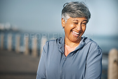 Buy stock photo Senior, fitness and woman portrait with wink at beach happy with walking, running or morning cardio in nature. Smile, face and cheerful elderly female at the sea for workout, exercise or sports walk