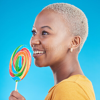 Buy stock photo Lollipop, thinking and a woman with candy in studio for sweets, rainbow and creative idea. Profile of happy black female person isolated on a blue background with sugar, freedom and smile or color