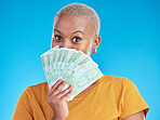 Money, winner and woman cover face on blue, studio background for winning, cash fan or financial loan. Lottery, bank and young african person with bonus, budget secret and finance profit in portrait