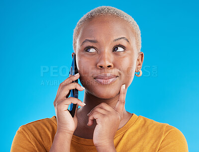 Buy stock photo Woman, phone call and thinking, ideas or college decision, listening to news and feedback on blue, studio background. Happy african person or student on mobile communication with choice or plan emoji