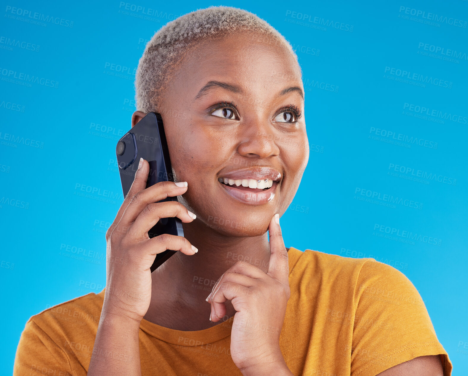 Buy stock photo Black woman, phone call and thinking of university decision, listening to news and feedback on a blue, studio background. Happy person or student on mobile communication with ideas or future planning